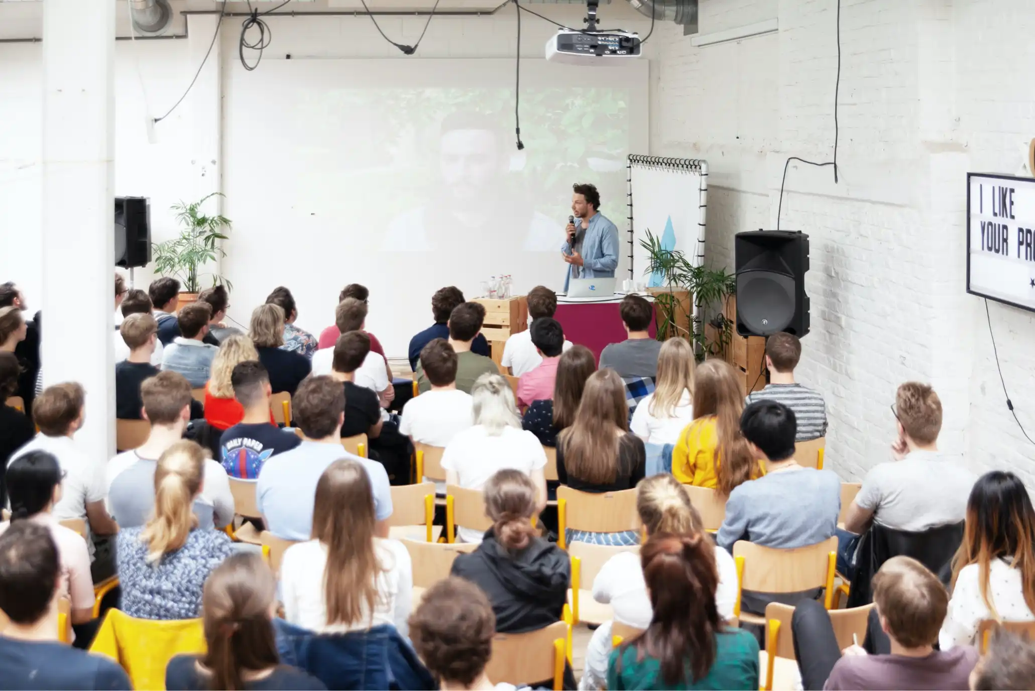 A speaker giving a talk for students